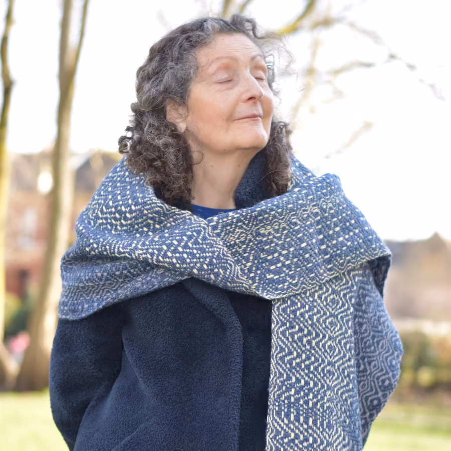 Anne-Marie with eyes closed modelling Soothing Waves Scarf